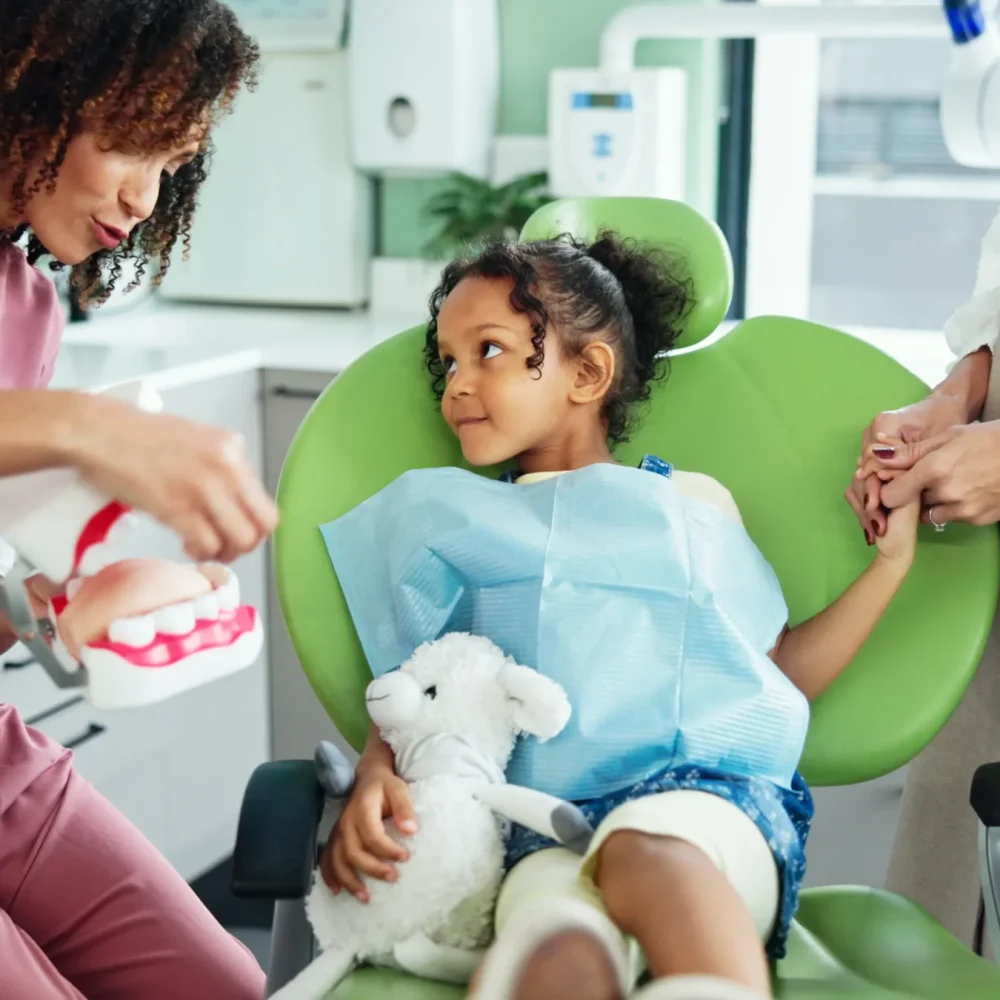 dentist-consulting-and-woman-with-child-in-clinic-2024-12-13-07-05-52-utc